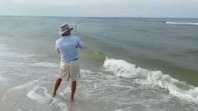 Surf fishing for blues. Mark lands another bluefish. We found a good school.